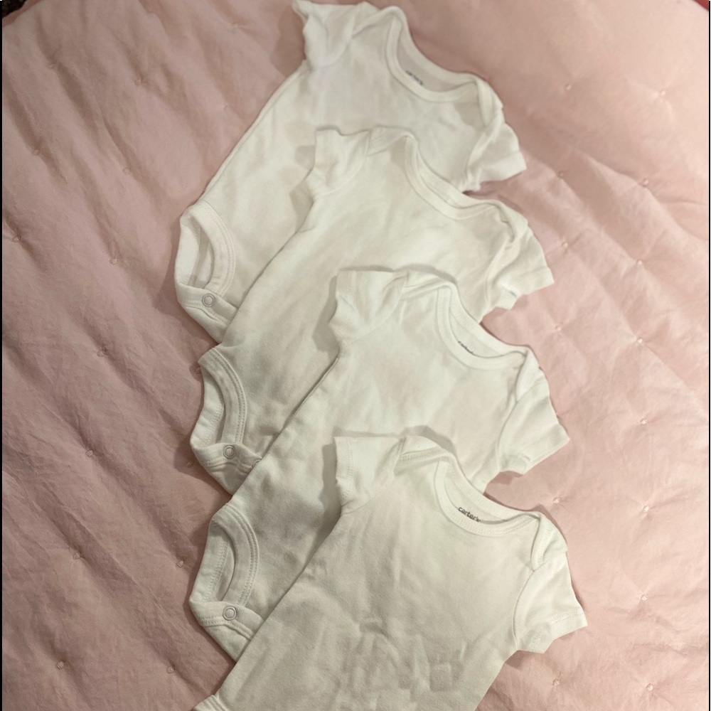 4 white newborn onesies